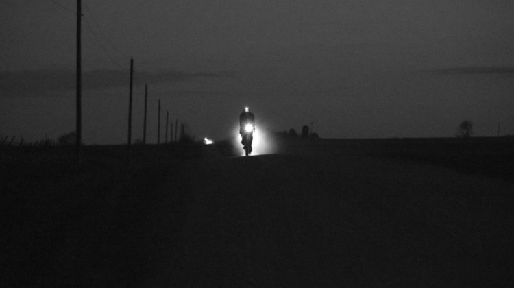 A rider blazes his way through the night along Iowa's gravel roads. 2018 Trans Iowa Gravel Race. © Jon Duke / Cyclocross Magazine