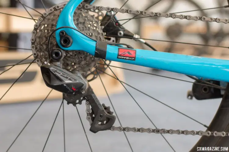 K-Force WE is wireless, but only from the shifter to the derailleur. The individual parts are still connected with wires to a central battery. Lance Haidet's FSA WE-equpped Pivot Vault, fresh off his Super G gravel race win. 2018 Sea Otter Classic. © Cyclocross Magazine