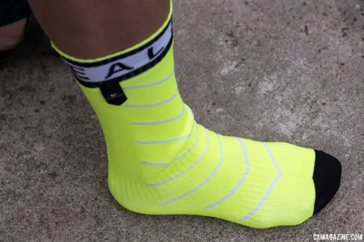 The Sealskinz Superthin Pro waterproof sock is thinner than earlier versions. We like the day-glo color, but it won't stay bright for long during 'cross season. Sealskinz Waterproof Socks. 2018 Sea Otter Classic. © C. Lee / Cyclocross Magazine