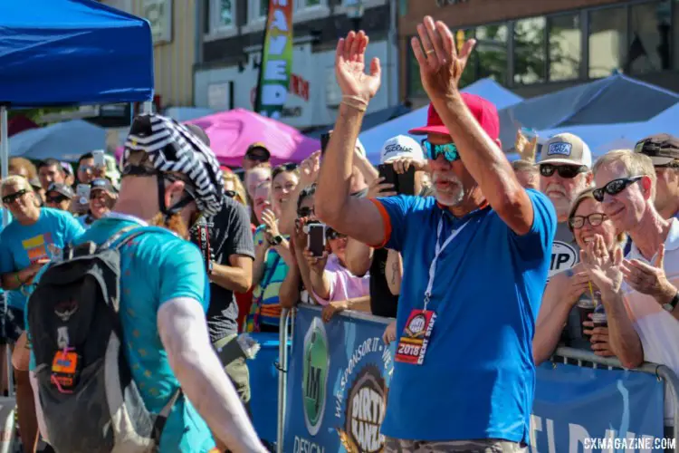 All riders received a hearty welcome home. Here, race director Jim Cummin welcomes DKXL winner Matt Acker. 2018 Dirty Kanza 200. © Z. Schuster / Cyclocross Magazine