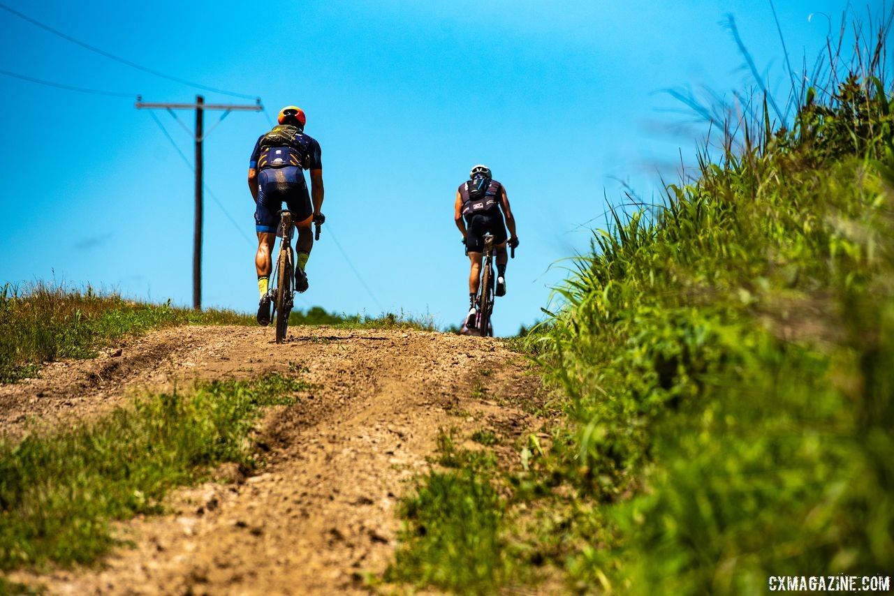 The condition of the gravel on the DK200 course varies quite a bit. Here, riders go up a small rise with a looser surface.2018 Dirty Kanza 200. © Ian Matteson/ ENVE Composites