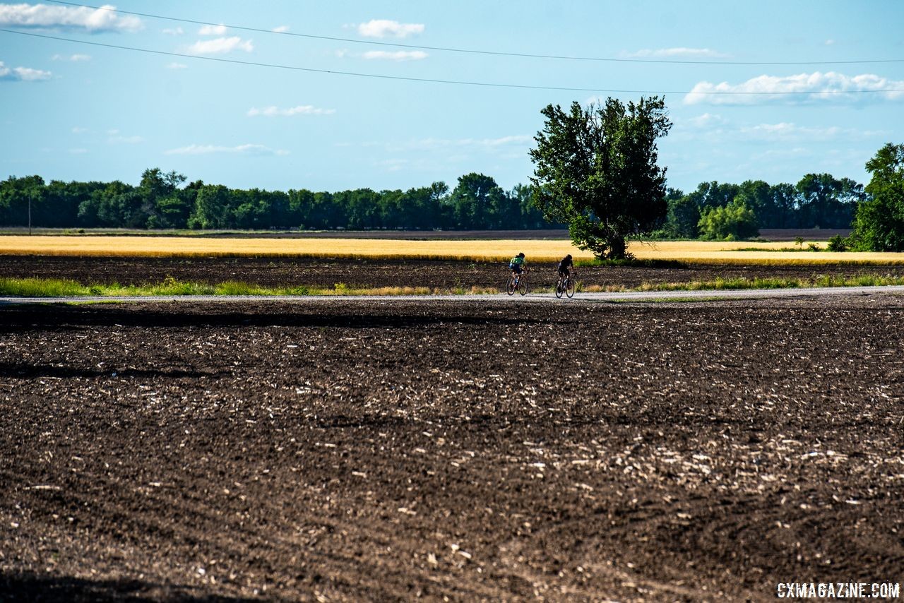 Two riders team up to make their way across a flat section of the DK200 course. 2018 Dirty Kanza 200. © Ian Matteson/ ENVE Composites