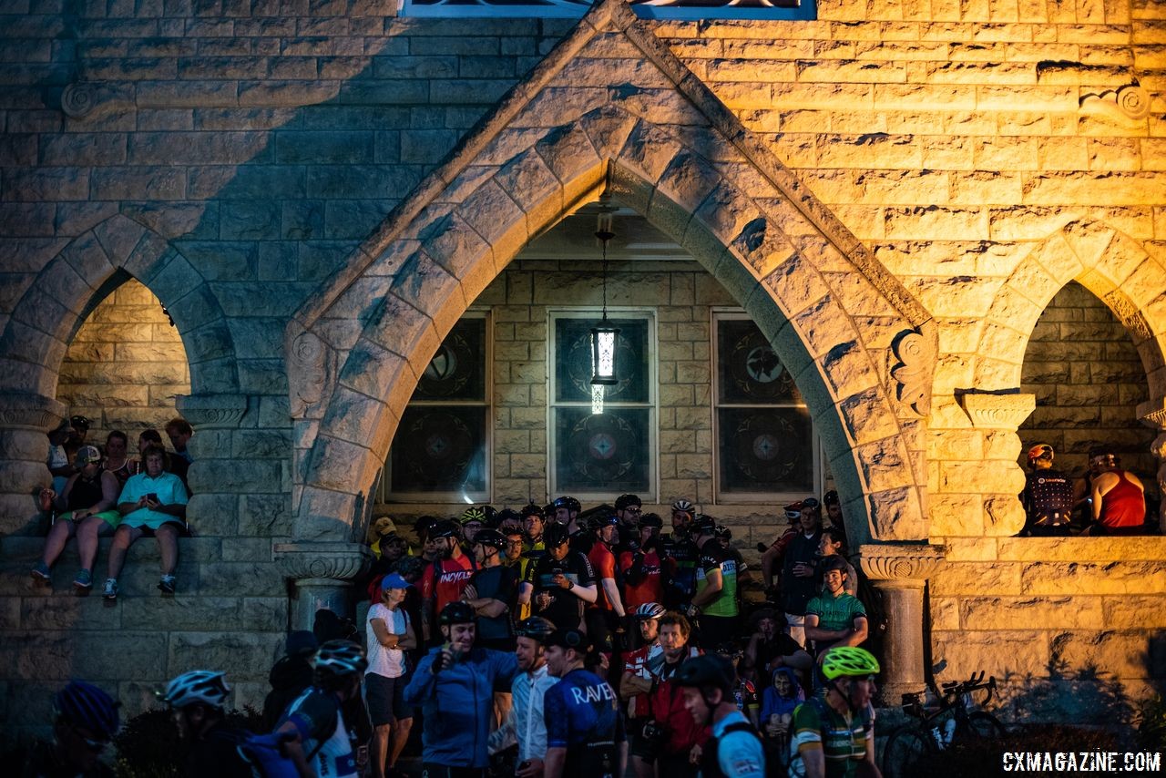 Riders hid from the rain where they could before the start of the DK200. 2018 Dirty Kanza 200. © Ian Matteson/ ENVE Composites