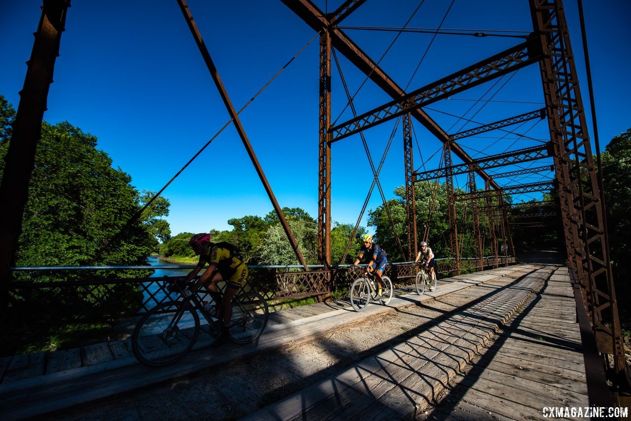 Riders got a brief respite from the gravel over this bridge crossing. 2018 Dirty Kanza 200. © Ian Matteson/ ENVE Composites