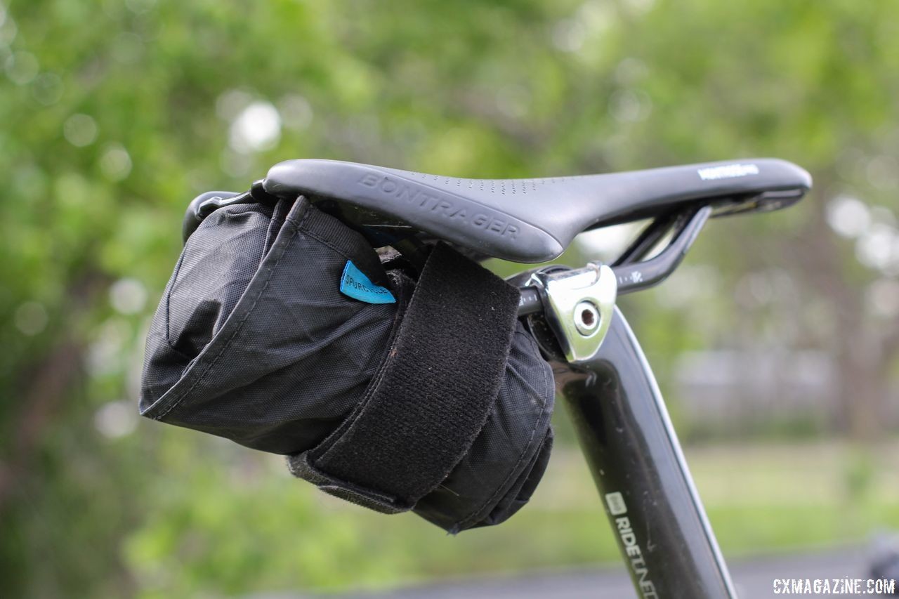 Seen here with two tubes, two tire levers and a multi-tool, the Saddle Bag fits under the saddle. Spurcycle Saddle Bag and Multi-Tool. © Cyclocross Magazine
