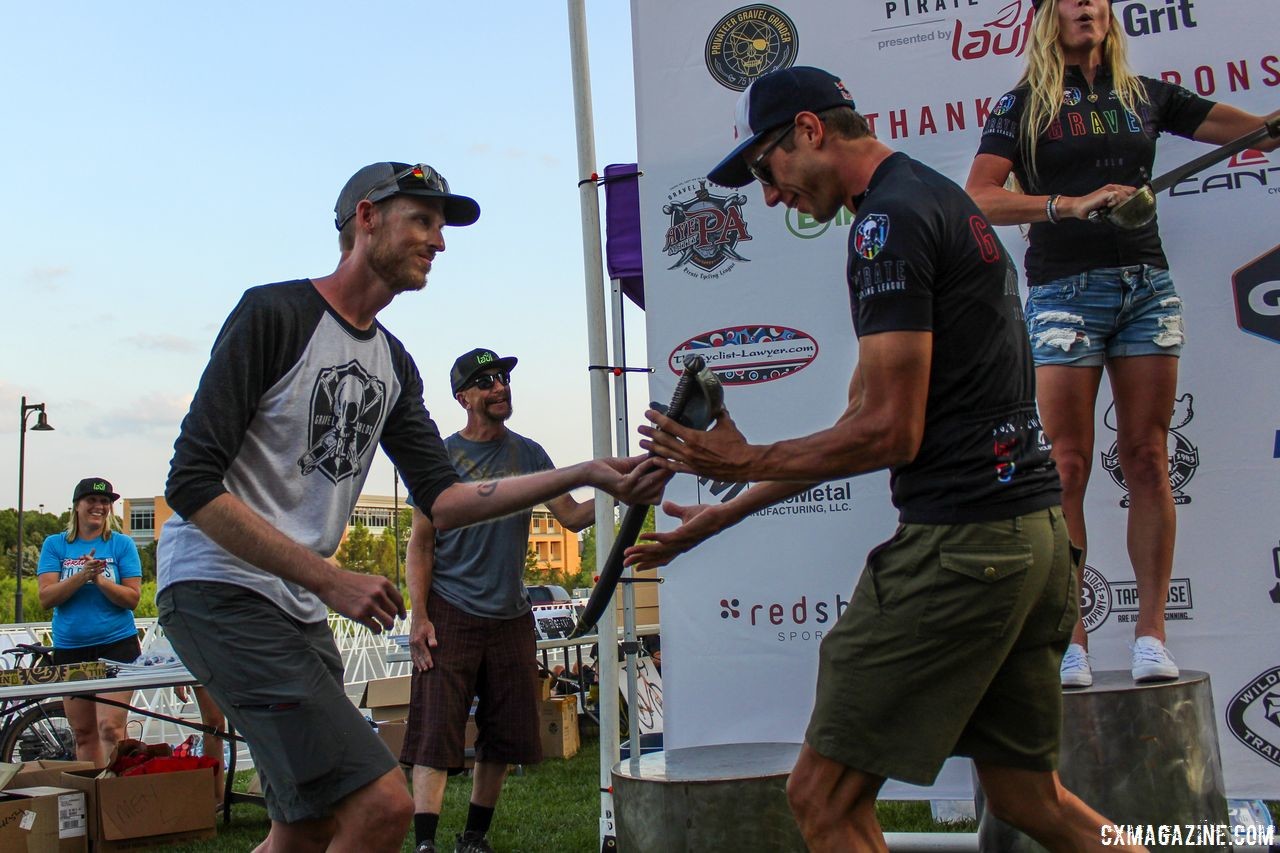 Race director Corey Godfrey presented Stirckland with his sword after the race. 2018 Gravel Worlds © Z. Schuster / Cyclocross Magazine