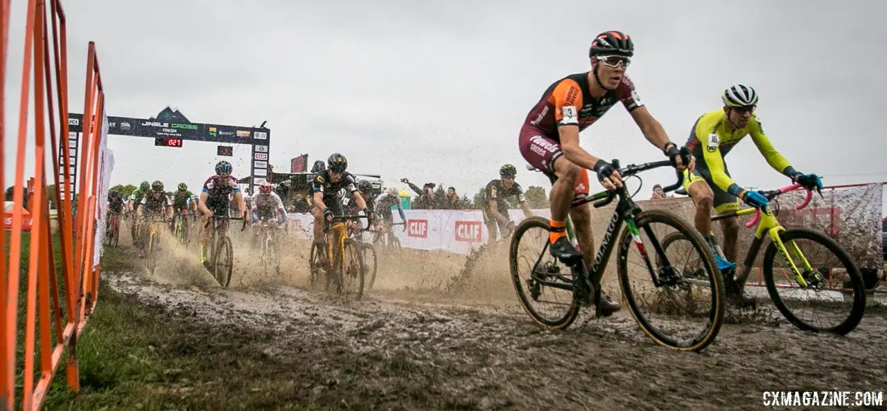 Laurens Sweeck and Kerry Werner splash through the holeshot. 2018 Jingle Cross Day 3, Sunday. © J. Corcoran / Cyclocross Magazine