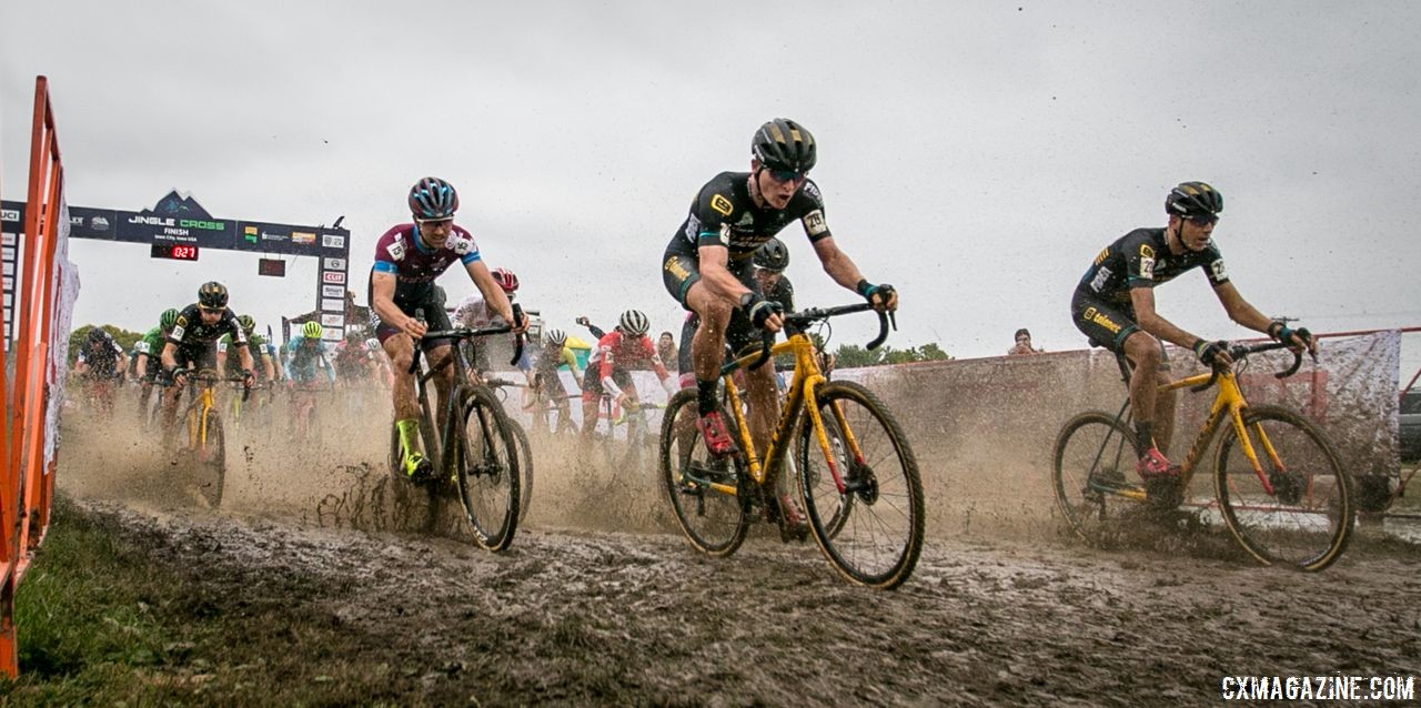 Riders splash through the holeshot mud. 2018 Jingle Cross Day 3, Sunday. © J. Corcoran / Cyclocross Magazine