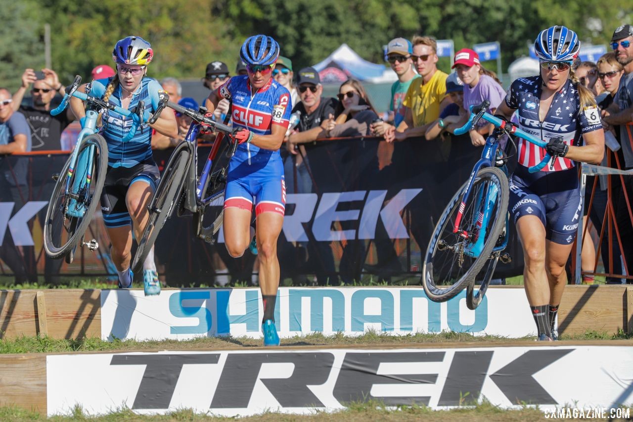 The chase of Richards, Nash and Compton hits the barriers. 2018 World Cup Waterloo. © R. Clark / Cyclocross Magazine