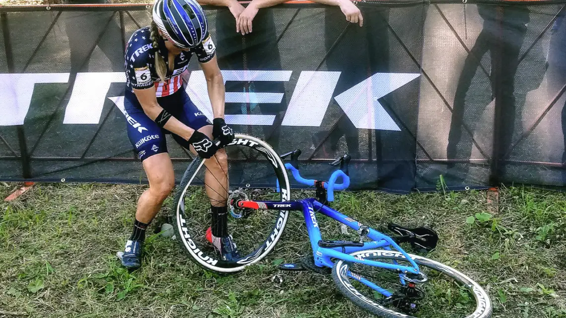 Katie Compton puts her tubular back on during World Cup Waterloo. photo: Little Tiny Fish