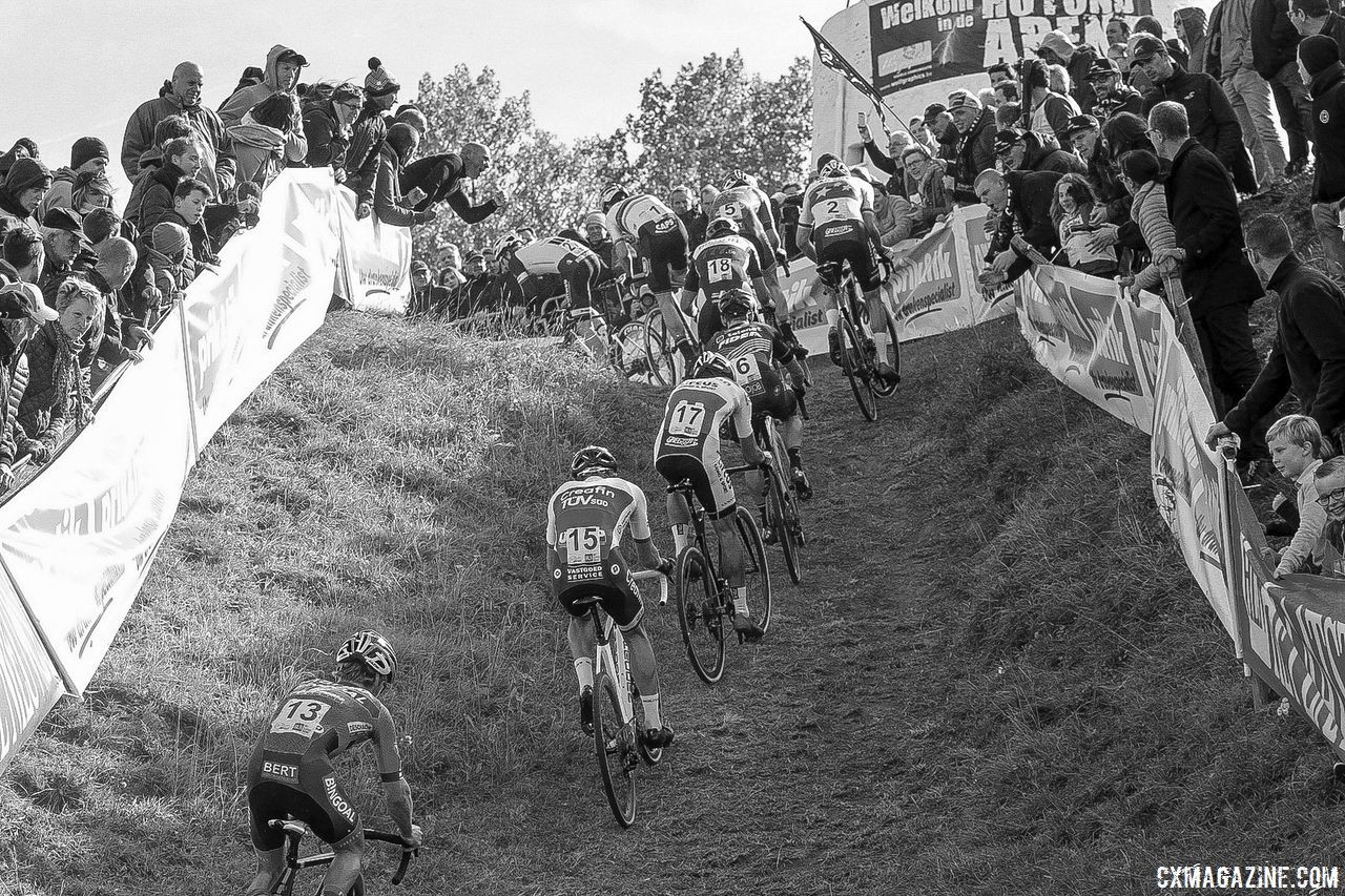A train of riders heads up a steep incline. 2018 Brico Cross Ronse / Hotondcross. © B. Hazen / Cyclocross Magazine