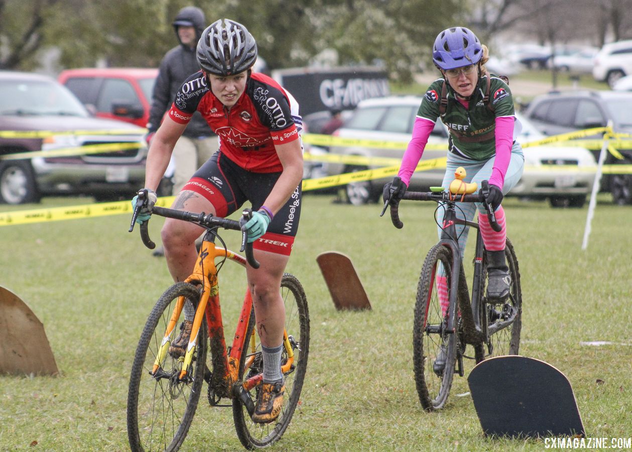 Emily Nordahl and Holly LaVesser make their way through the grave yard in Lap 2. 2018 Cross Fire, Sun Prairie, Wisconsin. © Z. Schuster / Cyclocross Magazine