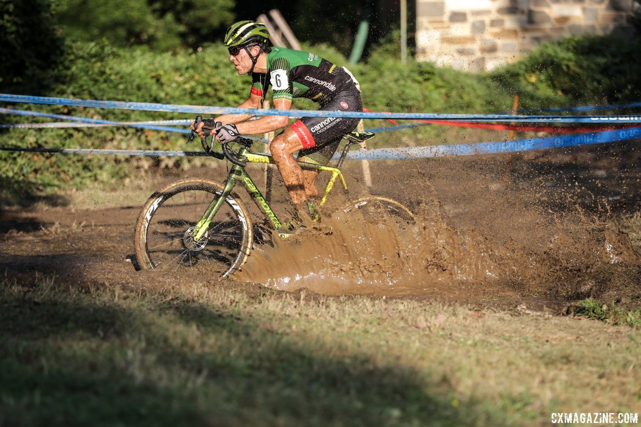 Curtis White splashes through the mud pit. 2018 Charm City Cross Day 2. © B. Buckley