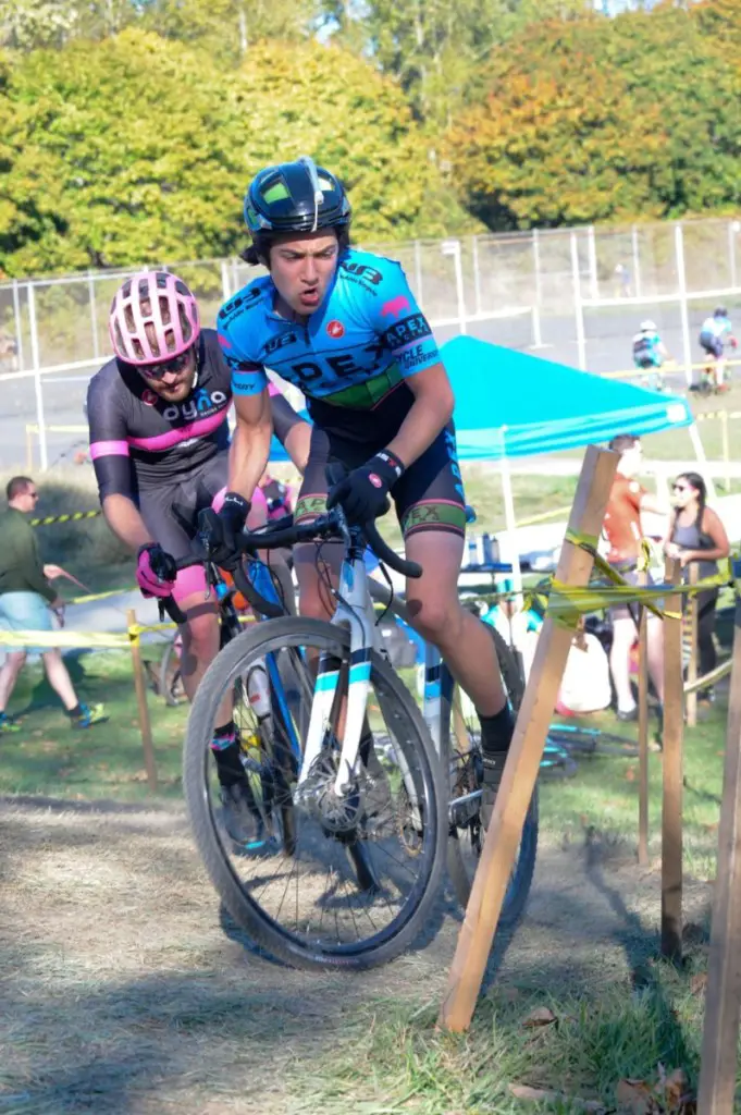 Adrian Magun and Garrett Sczechowski battle for a corner. 2018 MFG Cyclocross #4, Magnuson Park. © Geoffrey Crofoot