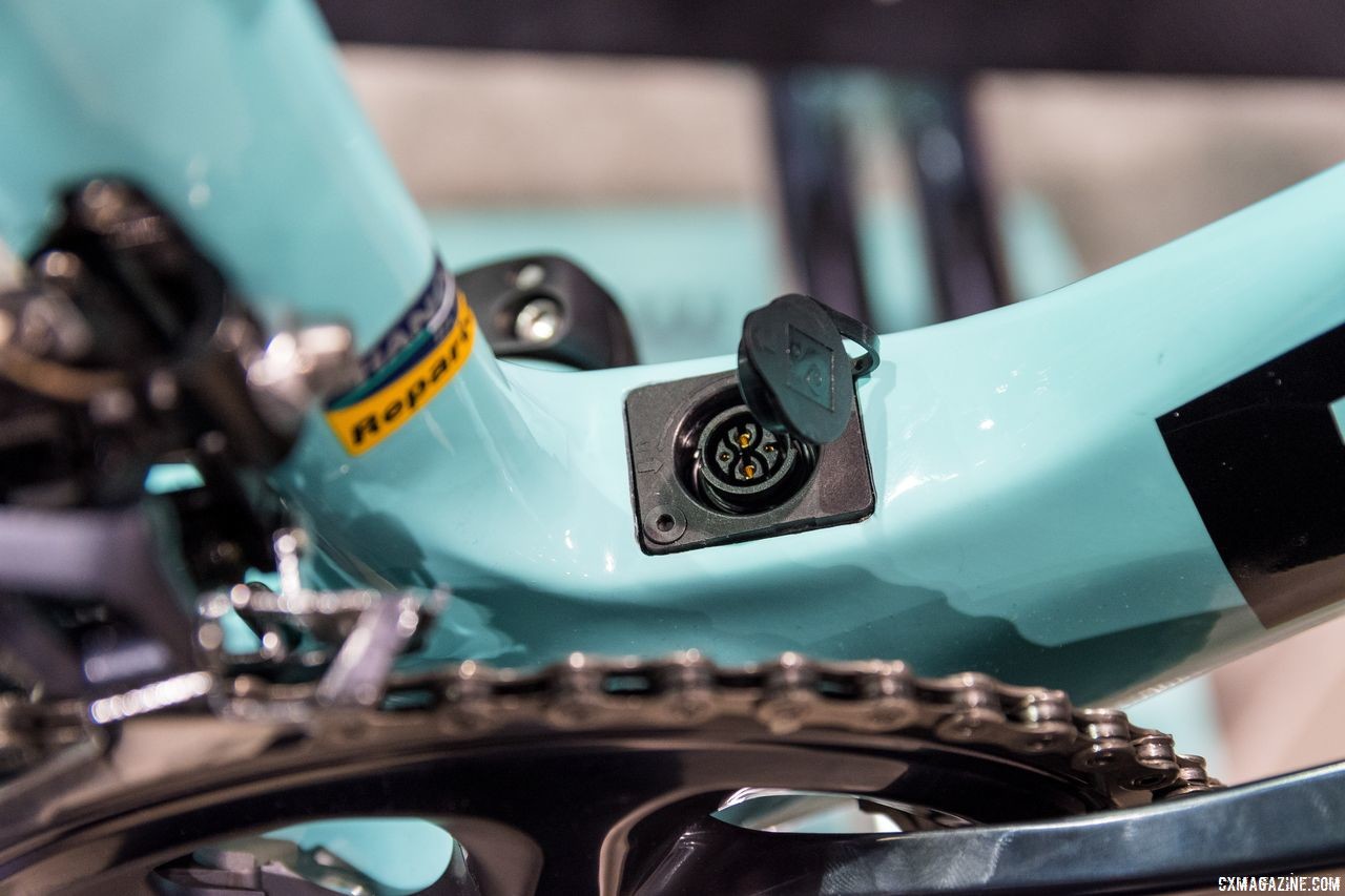 The charging port on the E-Road Aria at the bottom of the downtube. Bianchi Orso, Impulso All Road and E-Road Aria, Interbike 2018. © C. Lee / Cyclocross Magazine