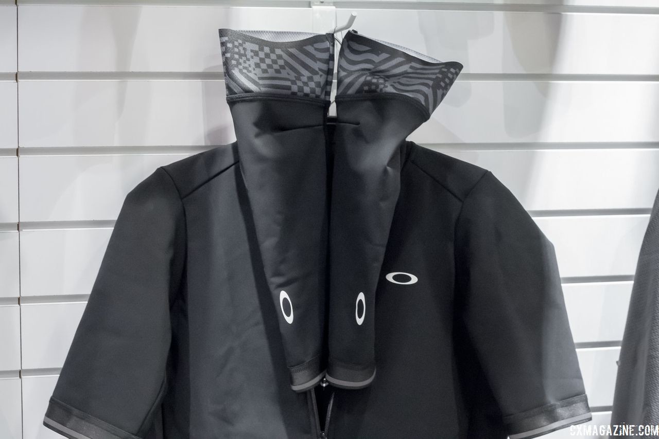 This unique convertible thermal "jacket" pairs a water-resistant, fleece-backed jersey with articulated arm warmers of the same fabric. Oakley's new road cycling kits. 2018 Interbike. © Cyclocross Magazine