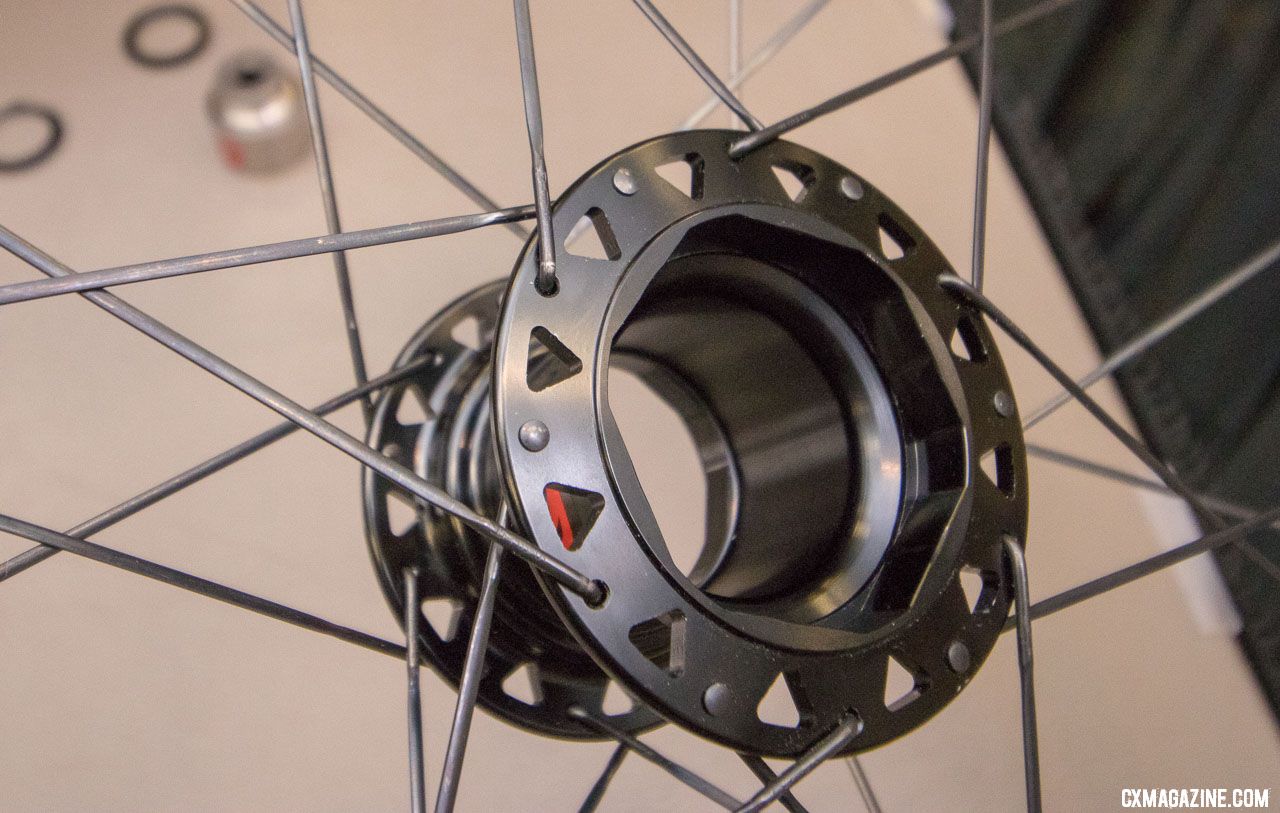 Two Point Zero's Phoenix modular hub allows allows you to swap your 700c alloy wheels for carbon tubulars, 650b gravel wheels, or aero section rims and still use your same cassette and rotor. There's a weight penalty, but potential time savings due to less brake and shifting adjustments. 2018 Interbike new products. © Cyclocross Magazine