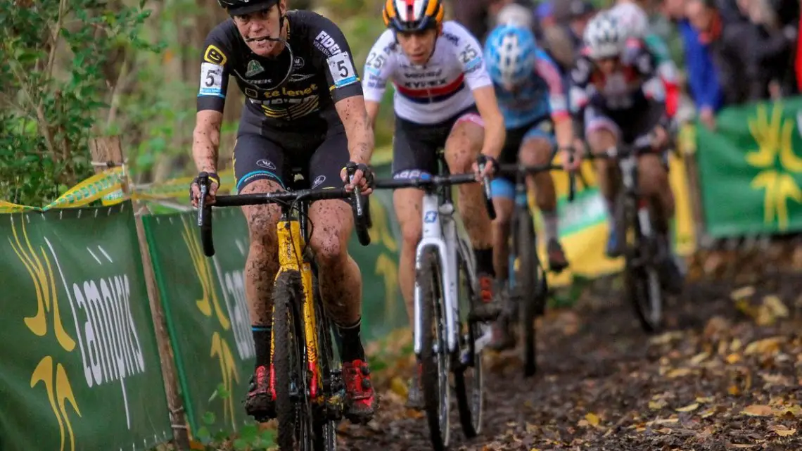 Ellen van Loy creatively saving her glasses until the pits. She finished lucky 13th, but was unlucky in hitting the ground several times . © B. Hazen / Cyclocross Magazine