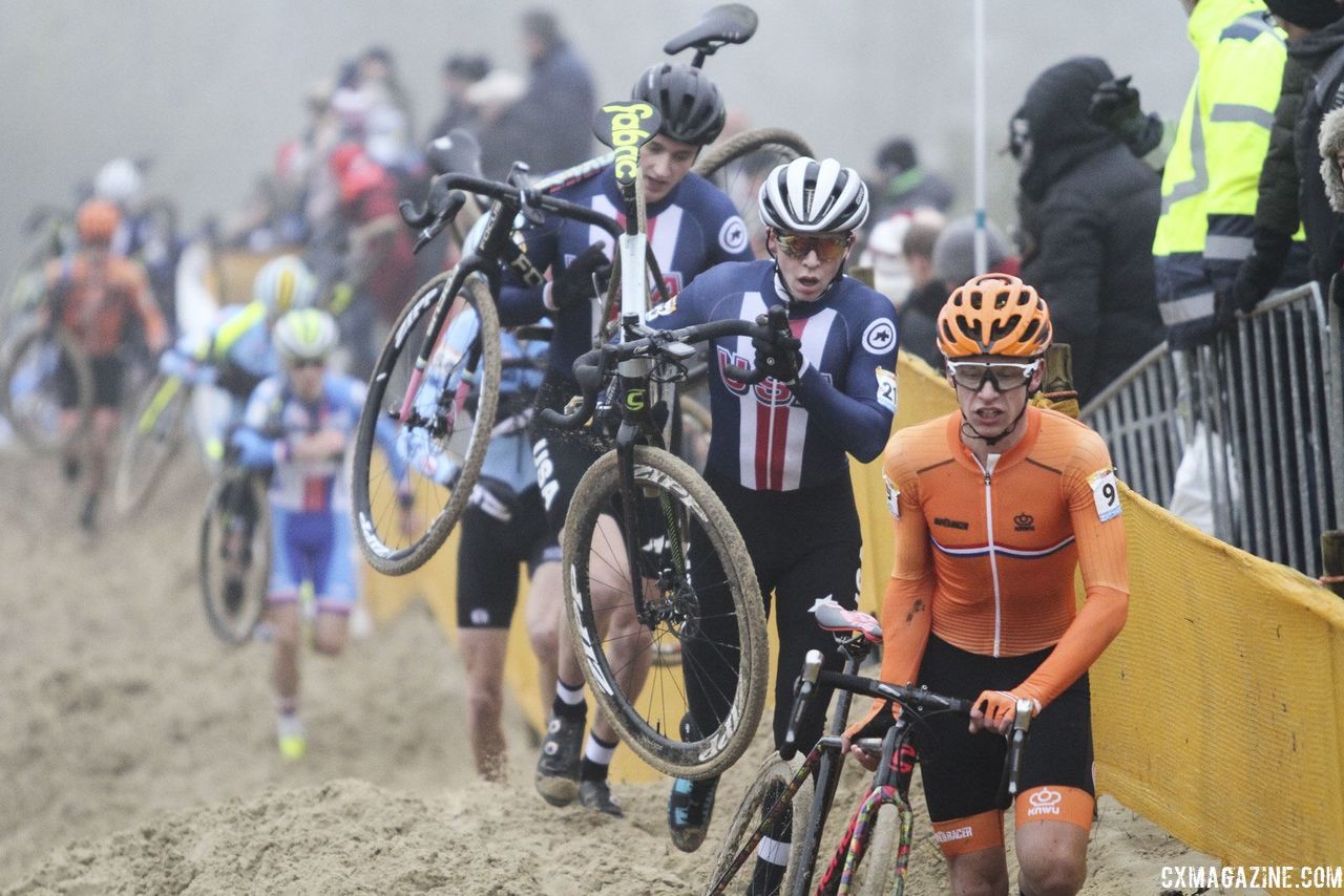 Alex Morton and Nick Carter join other riders running through the sand. 2018 World Cup Koksijde. © B. Hazen / Cyclocross Magazine