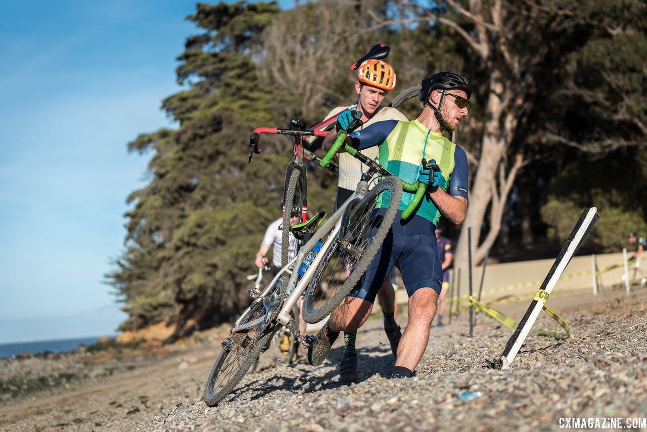 Riders take a corner on foot. 2018 Coyote Point Cyclocross Race 1, San Mateo, California. © J. Vander Stucken / Cyclocross Magazine