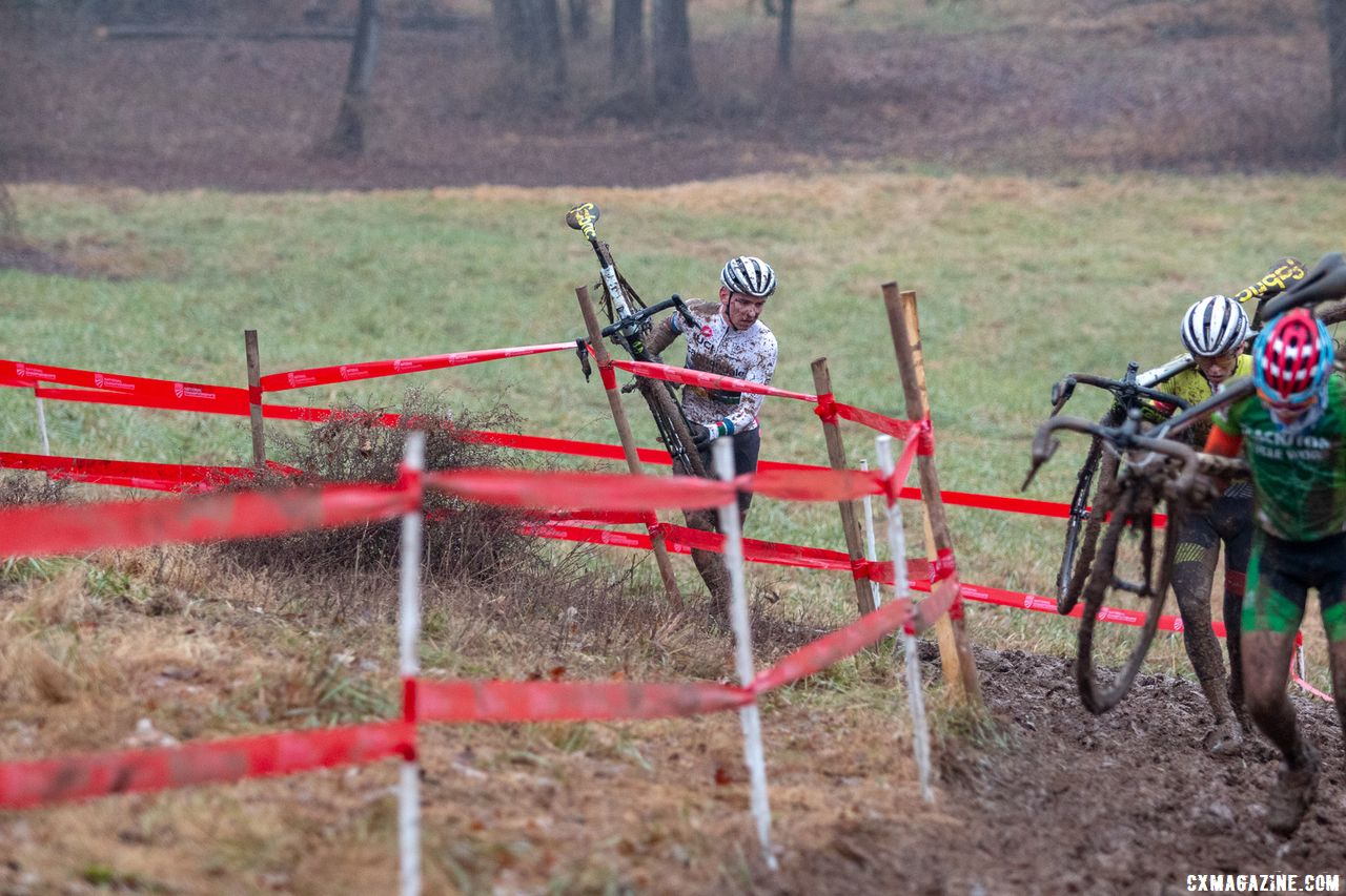 Sheffield got stuck in the tape, and watches Morton run away and catch lapped traffic. Junior Men 17-18. 2018 Cyclocross National Championships, Louisville, KY. © A. Yee / Cyclocross Magazine