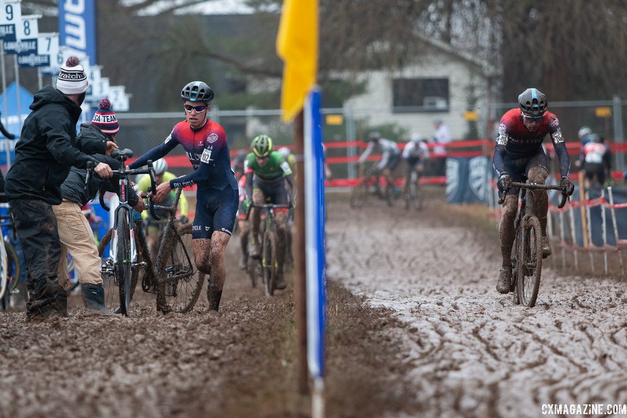 Eric Brunner pits while Stephenson skips on lap one. The two hit the corner at the same time. U23 Men. 2018 Cyclocross National Championships, Louisville, KY. © A. Yee / Cyclocross Magazine