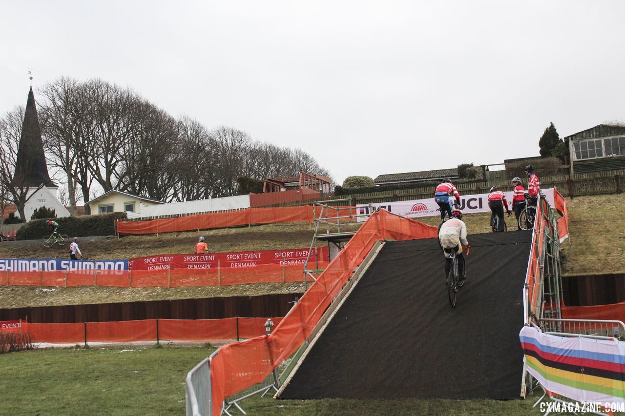 Flyovers are necessary to get up and over the 10-foot seawall. 2019 Bogense World Championships Course Preview. © Z. Schuster / Cyclocross Magazine