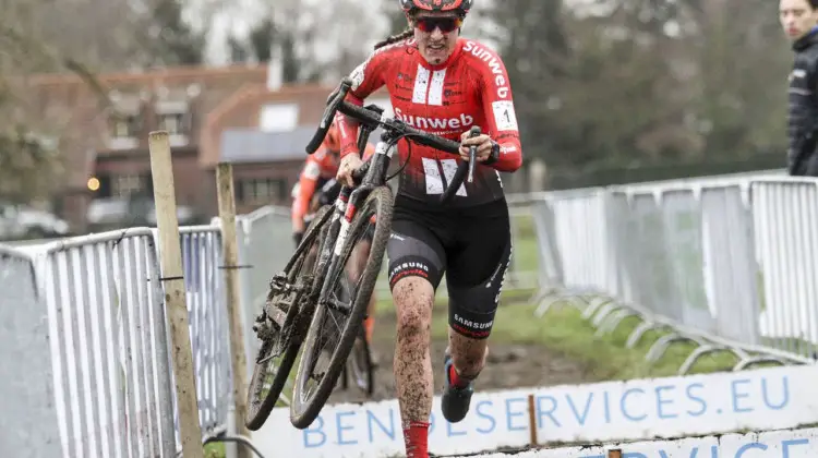 Lucinda Brand runs the barriers en route to her second Dutch National Championship. 2019 Dutch Cyclocross National Championships, Huijbergen. © B. Hazen / Cyclocross Magazine