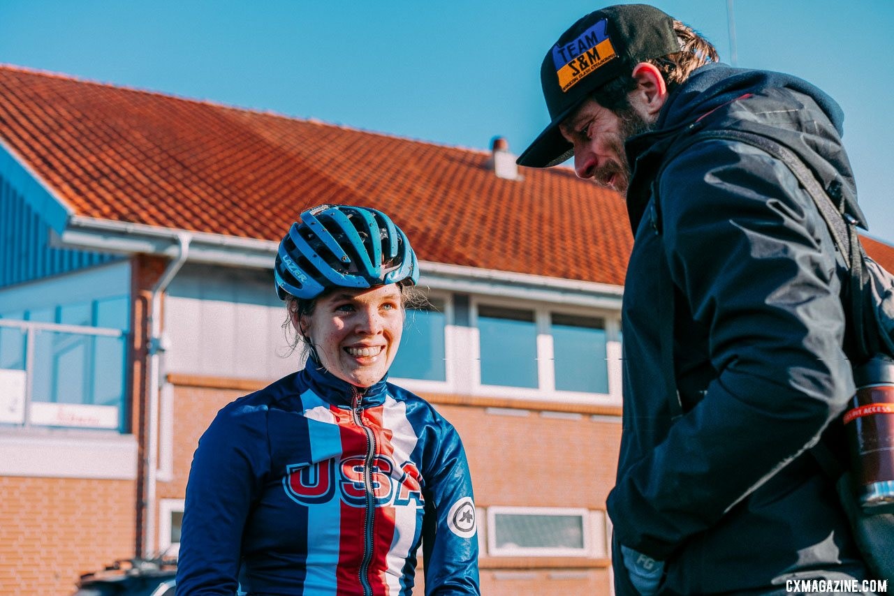 Clara Honsinger talks with Team S&M owner, Erik Tonkin. 2019 Cyclocross World Championships, Bogense, Denmark. © Taylor Kruse / Cyclocross Magazine