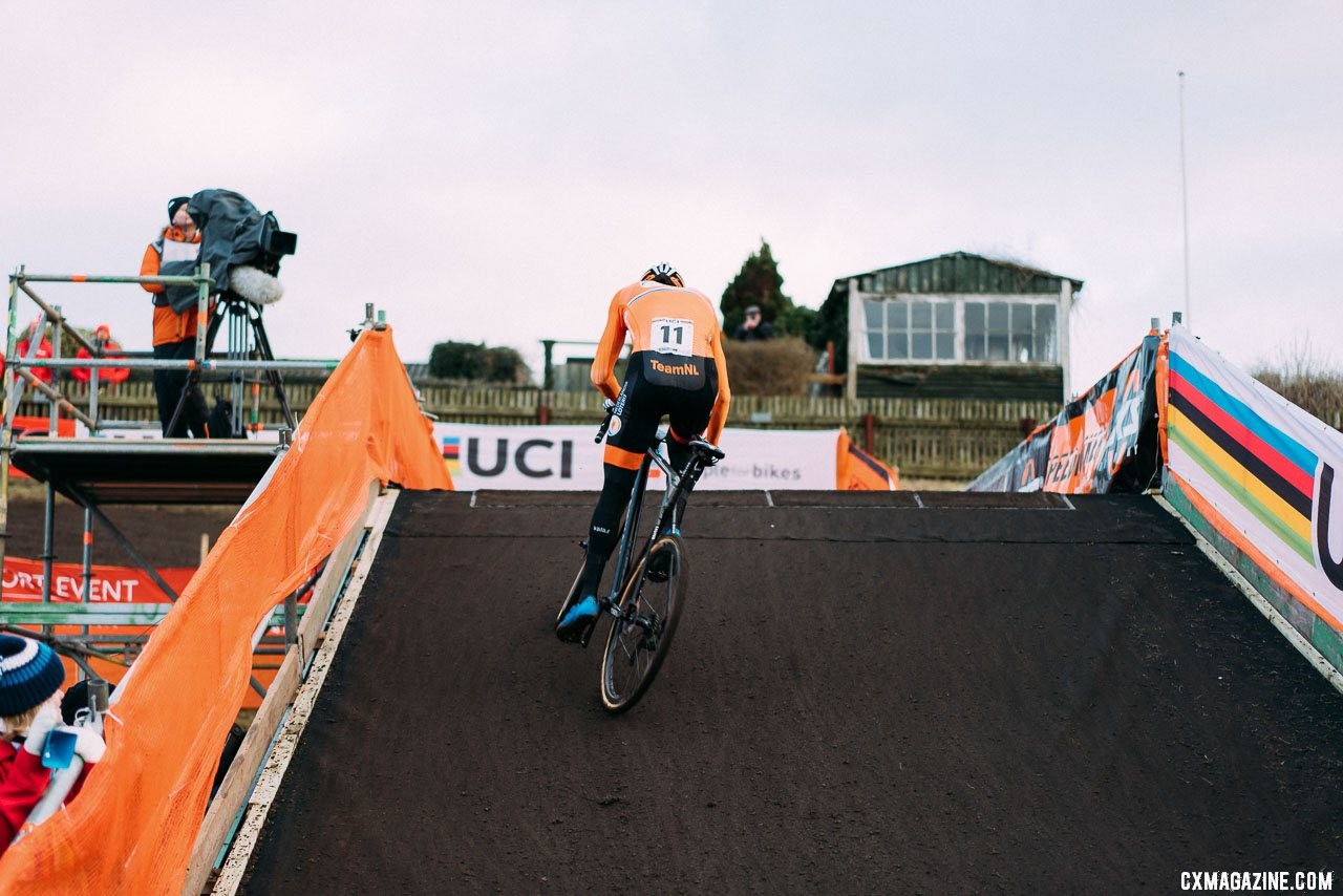 Mathieu van der Poel in control, scaling the muddy flyover. 2019 Cyclocross World Championships, Bogense, Denmark. © Taylor Kruse / Cyclocross Magazine