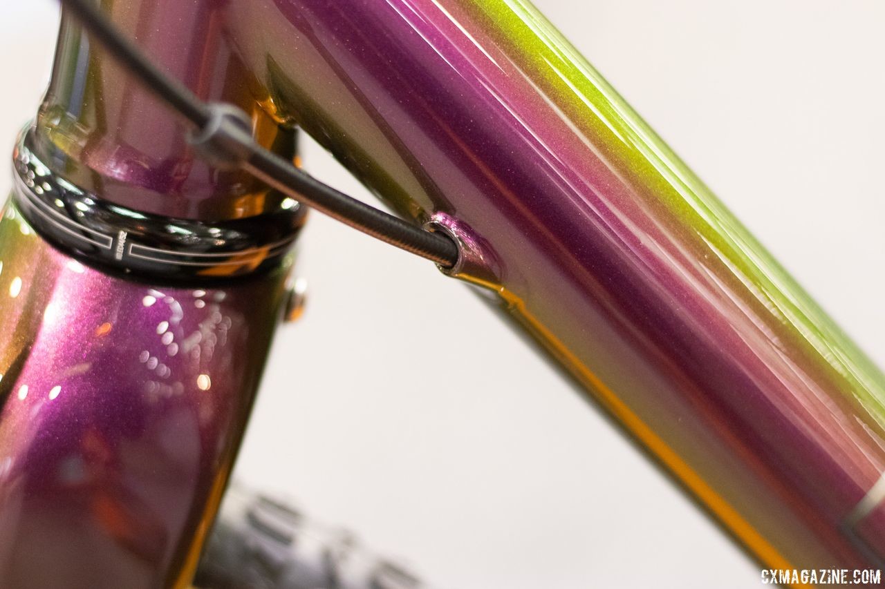 Cable ports were built into this red metallic titanium frame. Enigma titanium cyclocross bike. 2019 NAHBS Sacramento. © A. Yee / Cyclocross Magazine