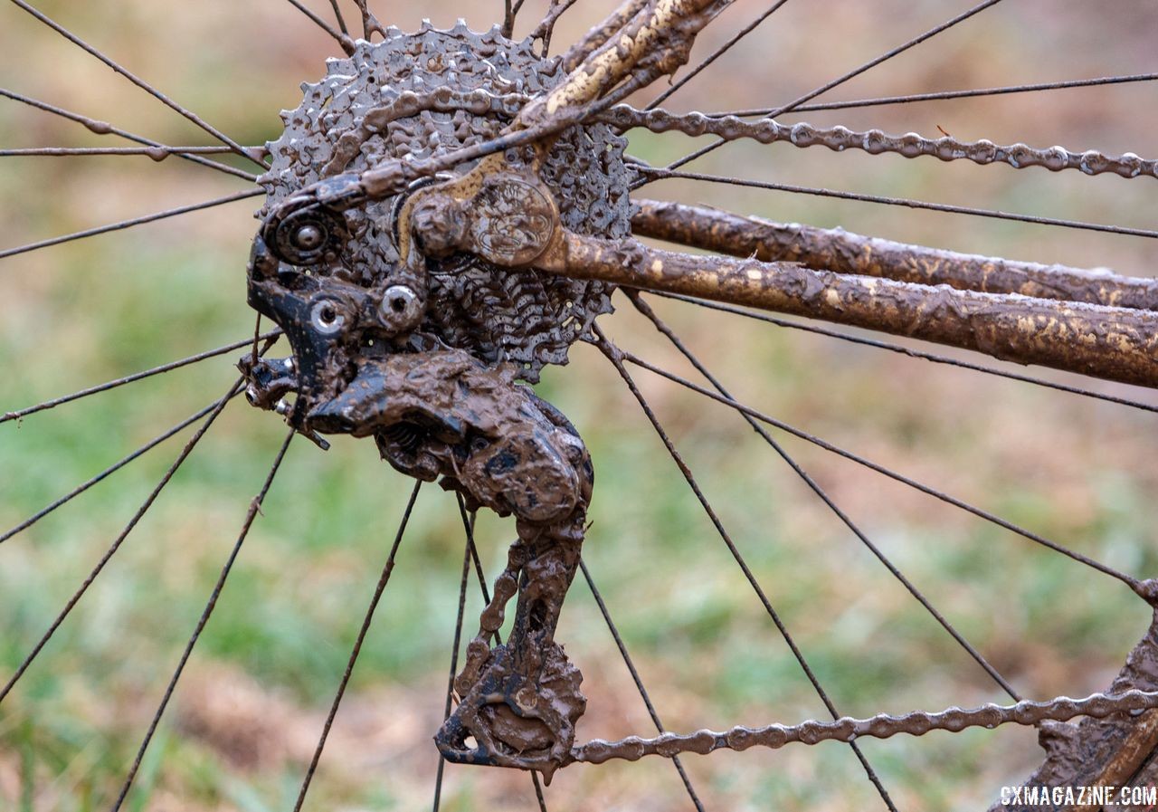 Until the RX800 derailleur was released, devices like this Wolf Tooth Tanpan were required to use a Shimano mountain derailleur and gain a clutch. Vida Lopez de San Roman's Sycip cyclocross bike. 2018 Cyclocross National Championships V2. Louisville, KY. © Cyclocross Magazine