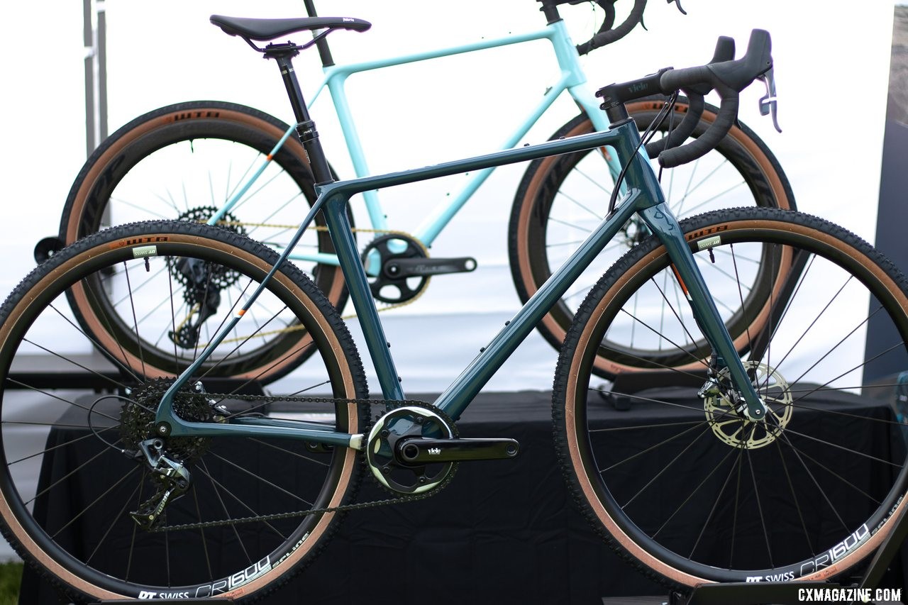 The Vielo V+1 UDG carbon gravel bike (foreground) is a slightly heavier, more affordable version of the UD in the back. Frames are identical in geometry and features. 2019 Sea Otter Classic. © A. Yee / Cyclocross Magazine