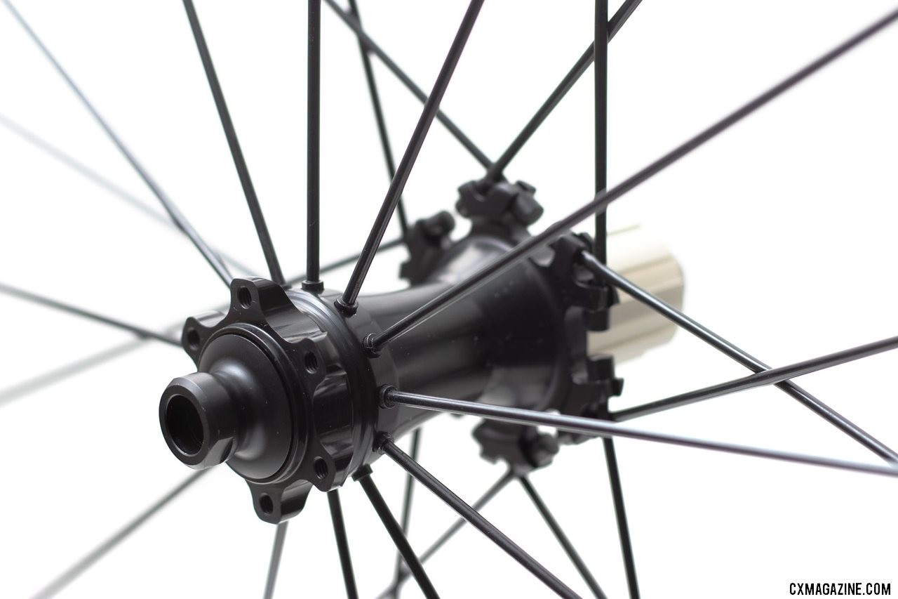 Spinergy's PBO spoke GX gravel wheelset use different caps to adapt to QR or thru axles. © Cyclocross Magazine