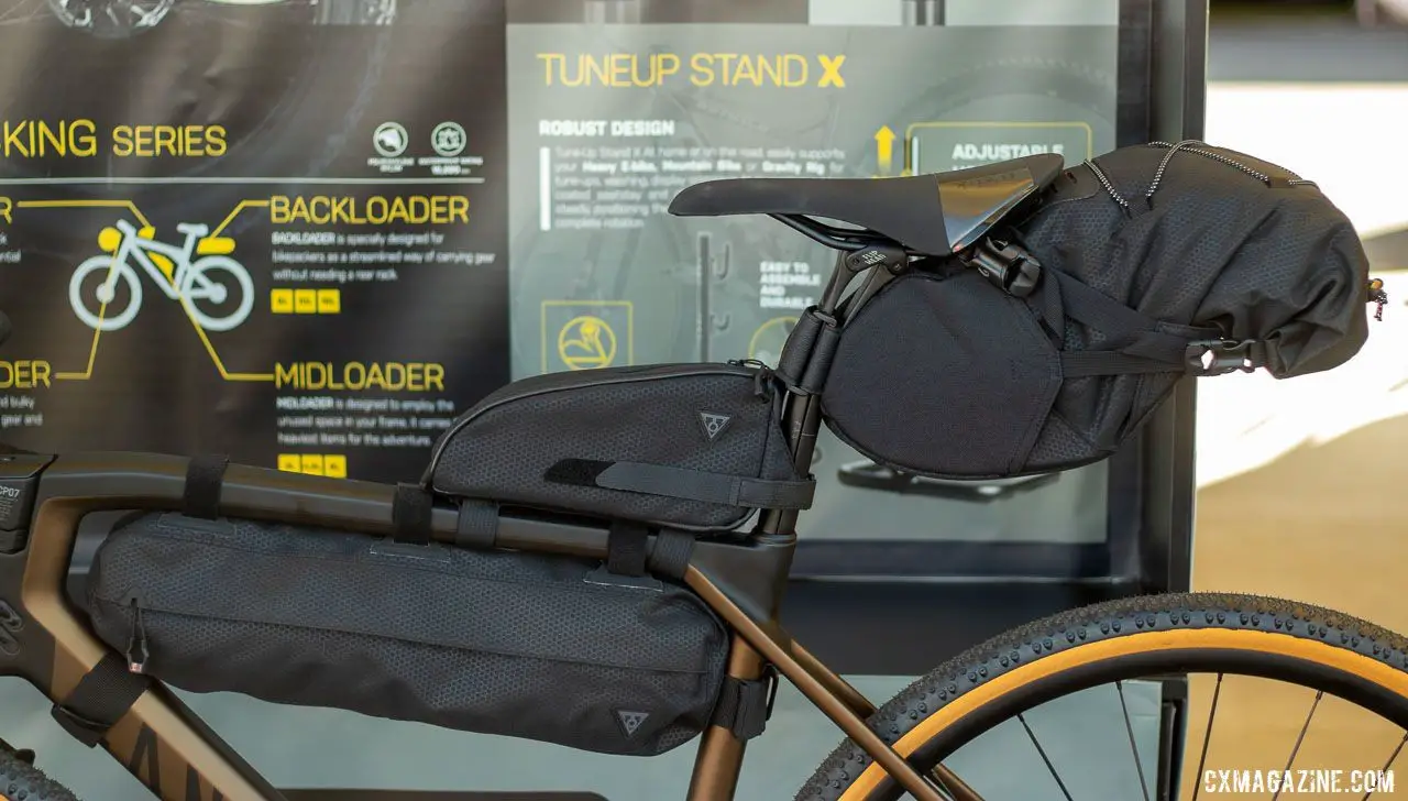 Topeak is all-in on the bikepacking movement. Its BackLoader and MidLoader bags help you avoid backpacks or trailers and get to camp. The MidLoader carries 6 liters (of gear, or beverage) and retails for $69.95. There are 6 and 4.5 liter versions available. The BackLoader hauls up to 15 liters and retails for $89.95 © A. Yee / Cyclocross Magazine