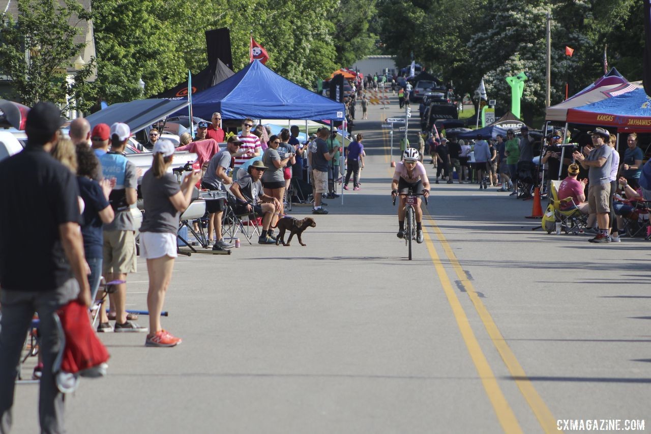 Christian Meier rolls down Mission Street, the longest stretch available for pit crews. 2019 Dirty Kanza 200, Panaracer / Factor p/b Bicycle X-Change Checkpoint 1. © Z. Schuster / Cyclocross Magazine