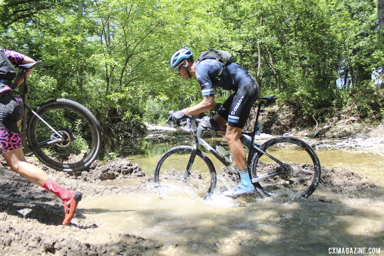 Riders used different ways of getting through the small creek crossing at Mile 110. 2019 Dirty Kanza 200 Gravel Race. © Z. Schuster / Cyclocross Magazine