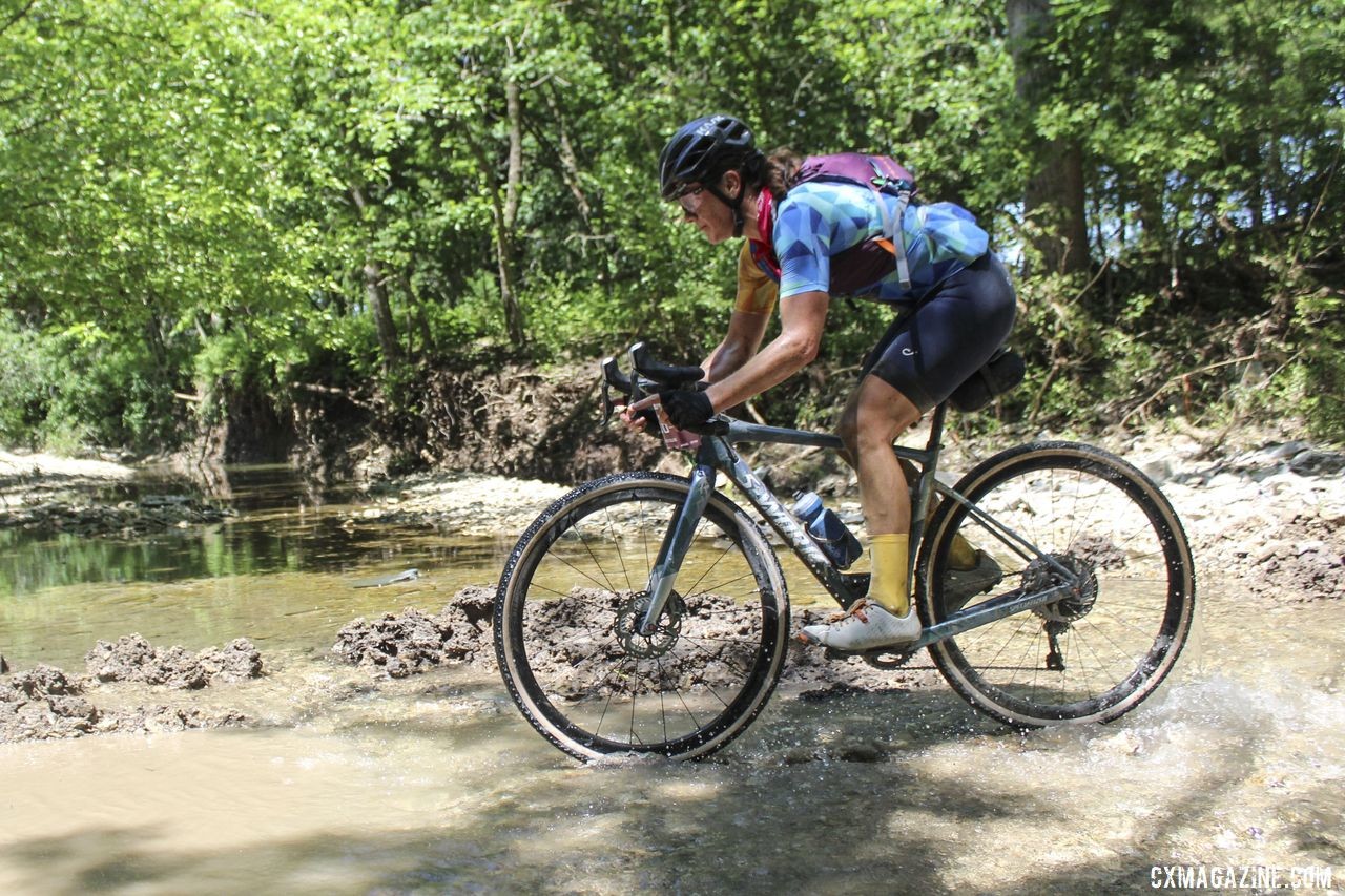 Creek crossing provided a chance to cool Dillon's feet off. 2019 Dirty Kanza 200 Gravel Race. © Z. Schuster / Cyclocross Magazine
