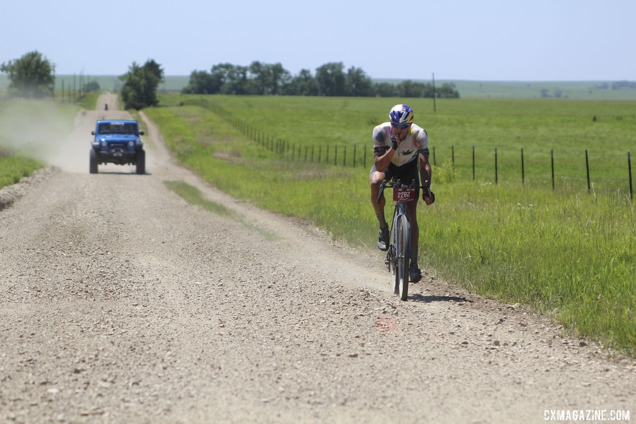 Colin Strickland snags some food during his 100-mile solo ride. 2019 Dirty Kanza 200 Gravel Race. © Z. Schuster / Cyclocross Magazine