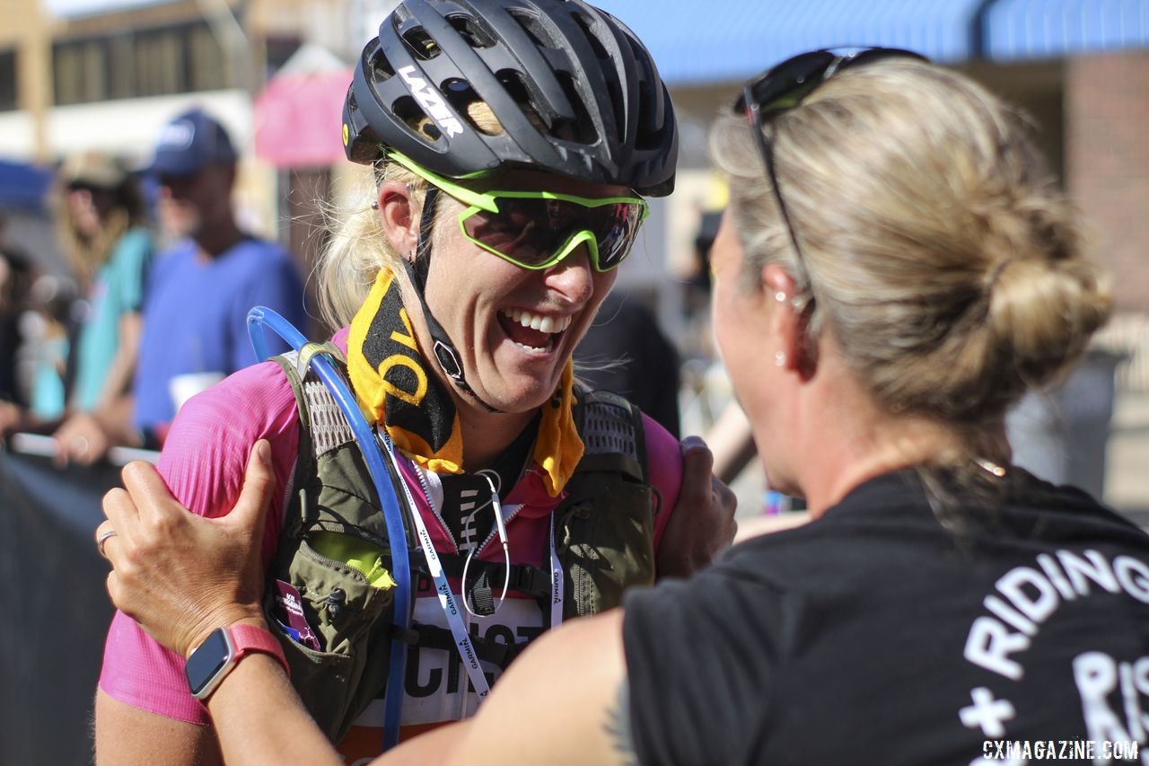 Meredith Miller welcomes Kristen Legan home after she finished the DKXL. 2019 Dirty Kanza 200 Gravel Race. © Z. Schuster / Cyclocross Magazine