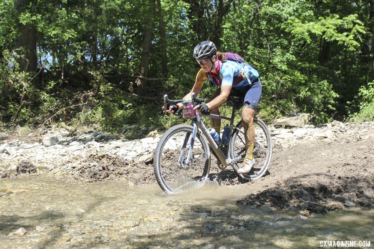 Olivia Dillon splashes through Little Ford with the lead. 2019 Women's Dirty Kanza 200 Gravel Race. © Z. Schuster / Cyclocross Magazine