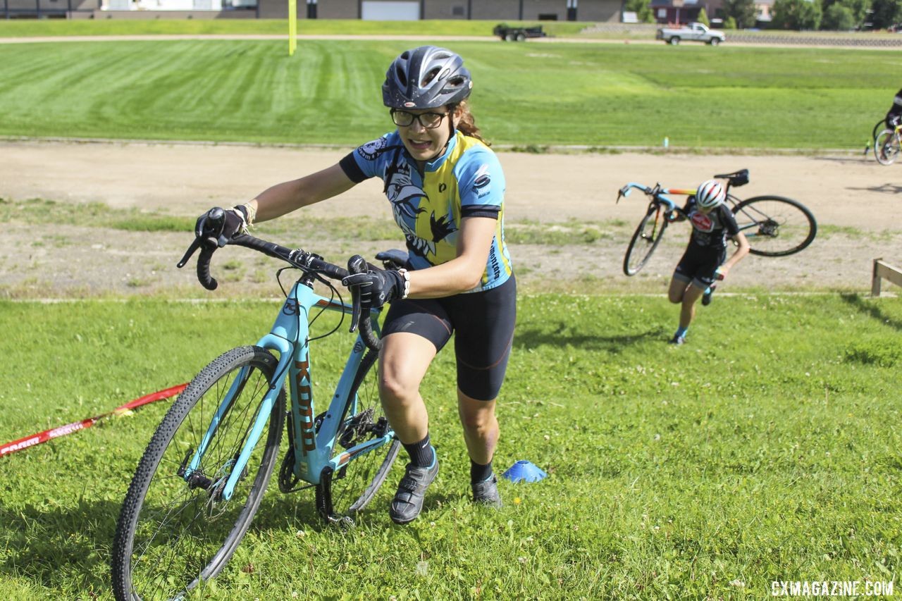 Disa Doherty runs after one of the barriers. 2019 Women's MontanaCrossCamp, Friday. © Z. Schuster / Cyclocross Magazine