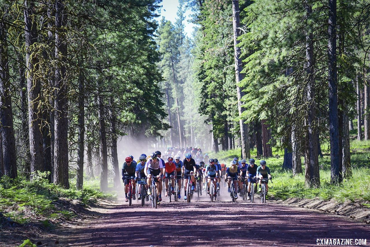 A large group of riders plows forward together on Day 1. 2019 Oregon Trail Gravel Grinder. © Adam Lapierre