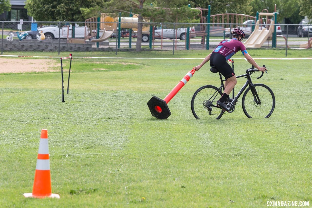 Coach Ortenblad helps set up for the next drill. 2019 Men's Montana Cross Camp. © Tom Robertson