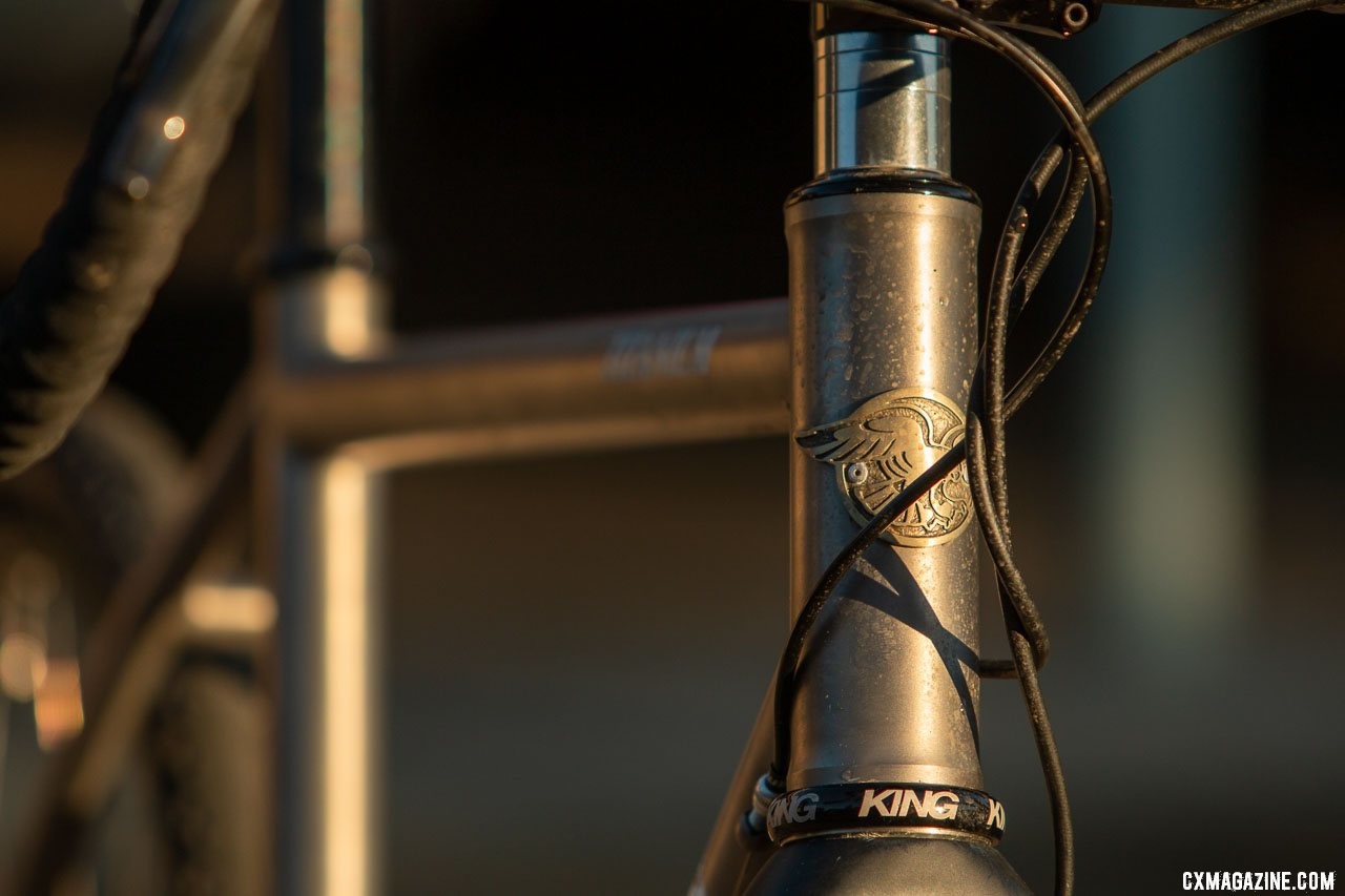 Whether splashed with mud or sun, the Merlin Sandstone titanium gravel bike should remain corrosion free. The head badge is just one detail that differentiates Merlin from its sister brand, Dean. © Cyclocross Magazine