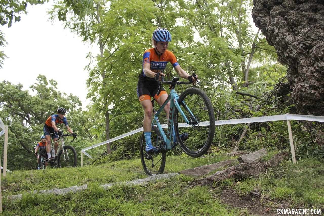 Clara Honsinger sends it over the granite block into a descent. 2019 Rochester Cyclocross Friday Pre-Ride. © Z. Schuster / Cyclocross Magazine