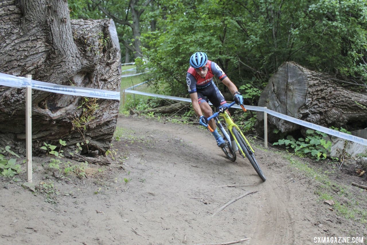 Kerry Werner passes through the entrance to Double Trouble, which was formed by cutting a downed willow tree. 2019 Rochester Cyclocross Day 2, Sunday. © Z. Schuster / Cyclocross Magazine