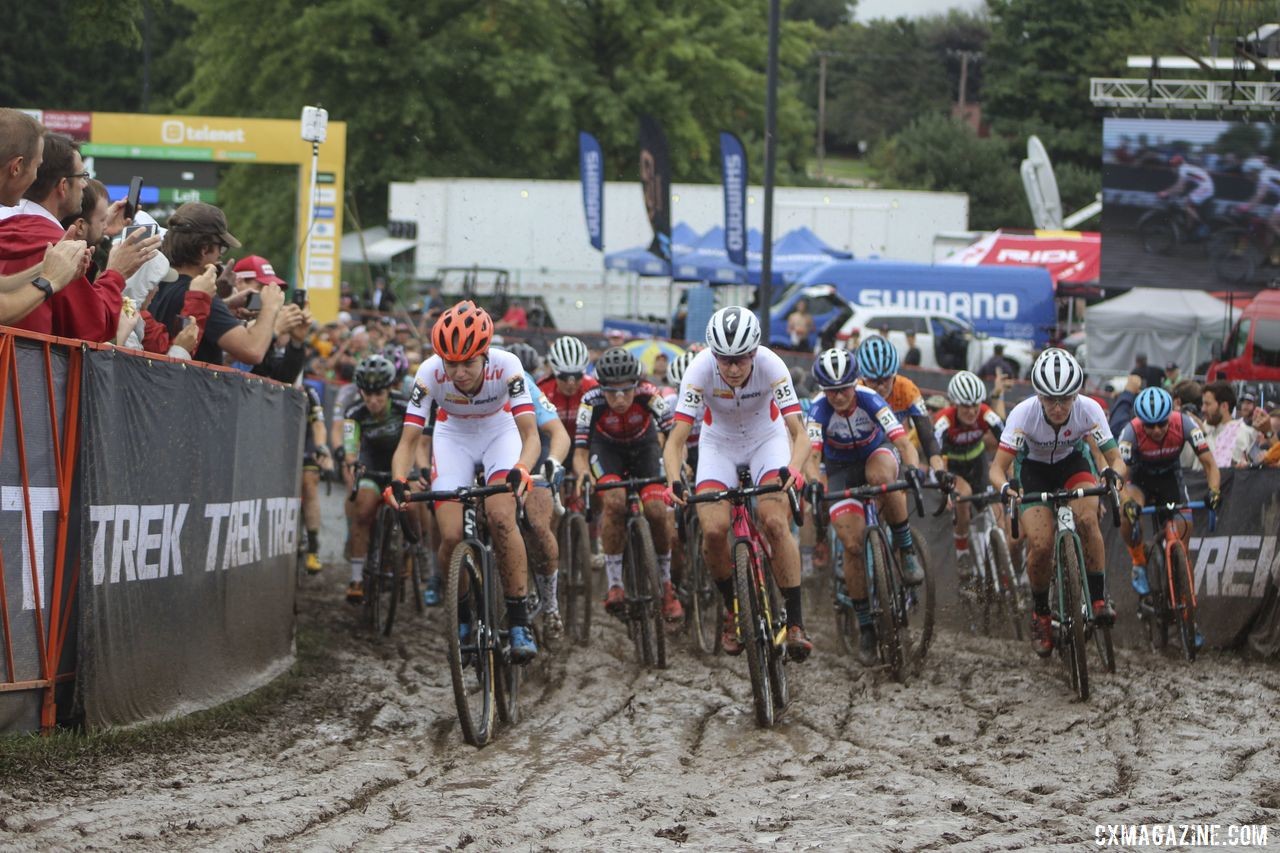 Inge van der Heijden and Maghalie Rochette help lead out the holeshot. © Z. Schuster / Cyclocross Magazine