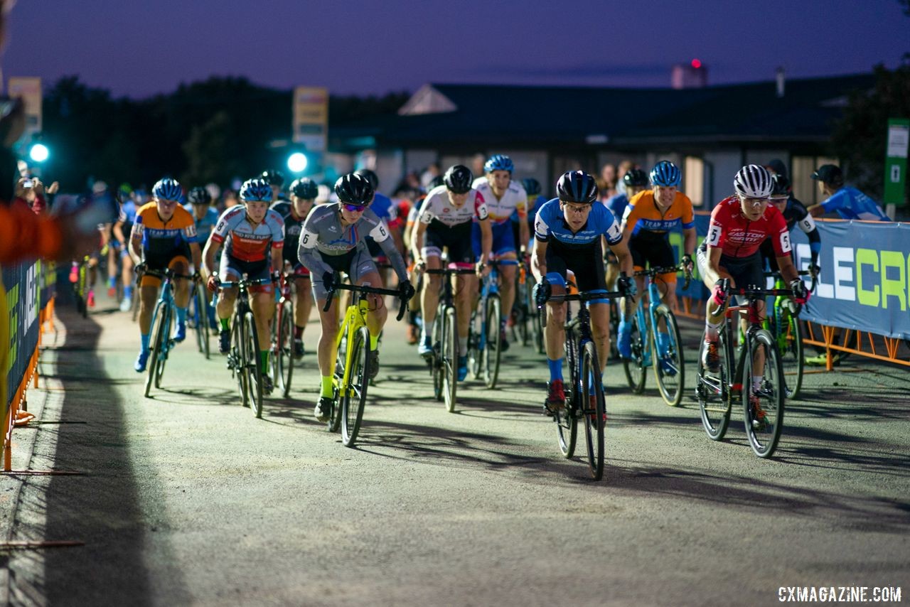 Regina Legge leads out the holeshot Friday night. 2019 Jingle Cross Weekend. © Drew Coleman