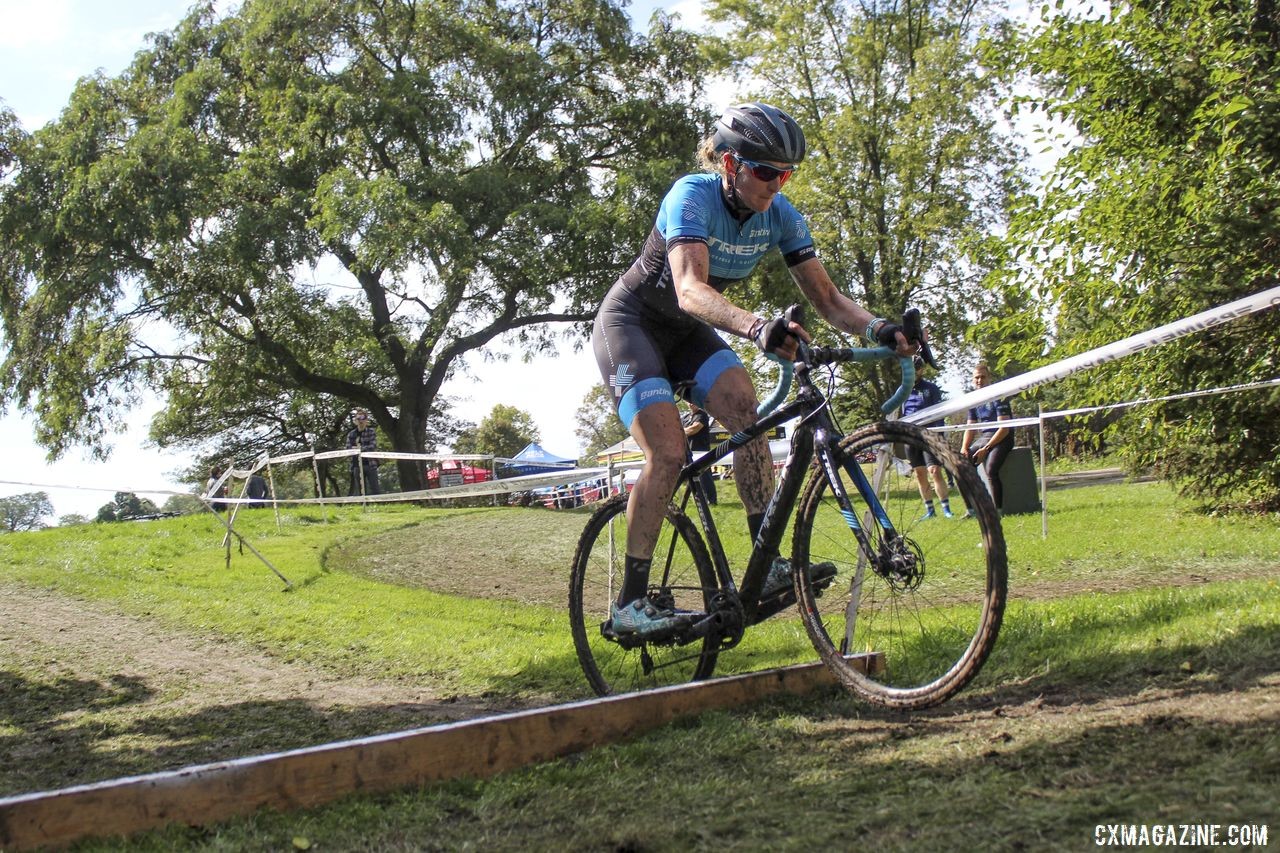 Elite Women's winner Erin Feldhausen hops the one barrier on the course. 2019 CCC Hopkins Park CX at Indian Lakes. © Z. Schuster / Cyclocross Magazine